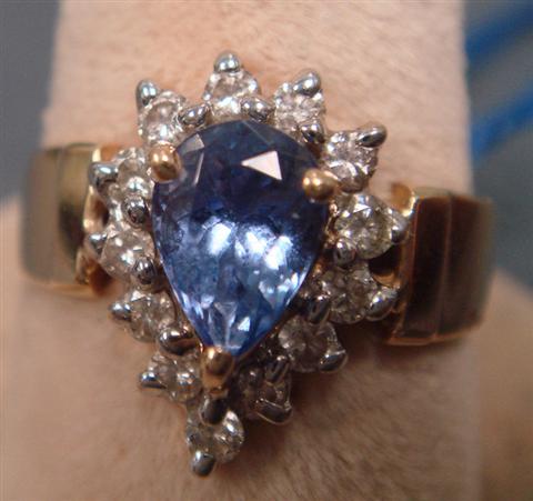 Appraisal: K YG tanzanite and diamond ring mm x mm stone