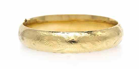 Appraisal: A Karat Yellow Gold Bangle Bracelet with foliate motif accent