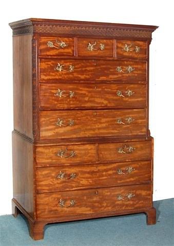 Appraisal: A GEORGE III MAHOGANY TALLBOY with carved blind fret cornice