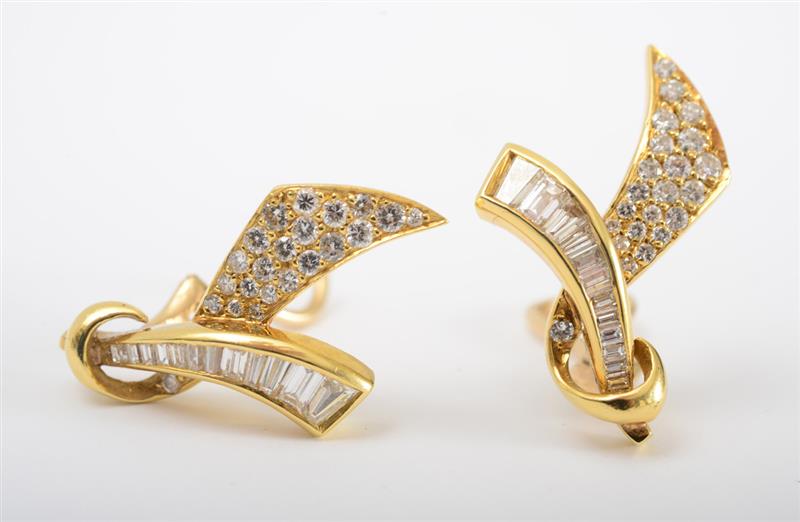 Appraisal: PAIR OF K GOLD AND DIAMOND EARCLIPS Designed as ribbon