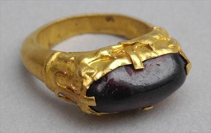 Appraisal: SASSANIAN RING Hollow gold ring decorated with gamboling gazelles with