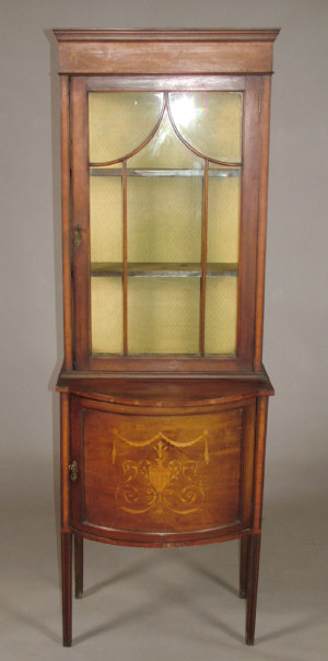 Appraisal: An Edwardian mahogany and inlaid display cabinet the double cavetto