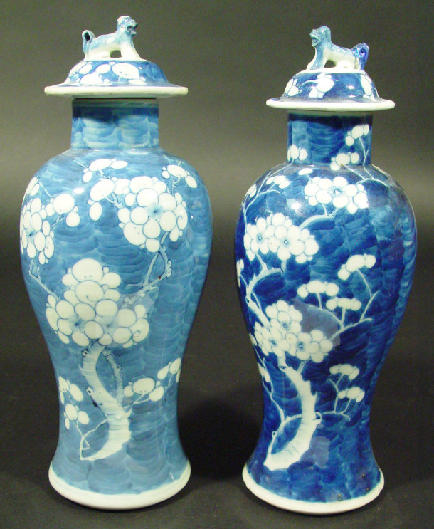 Appraisal: Two Chinese porcelain baluster vases and covers with dog of