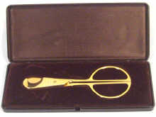 Appraisal: A presentation boxed gold plated cigar cutter