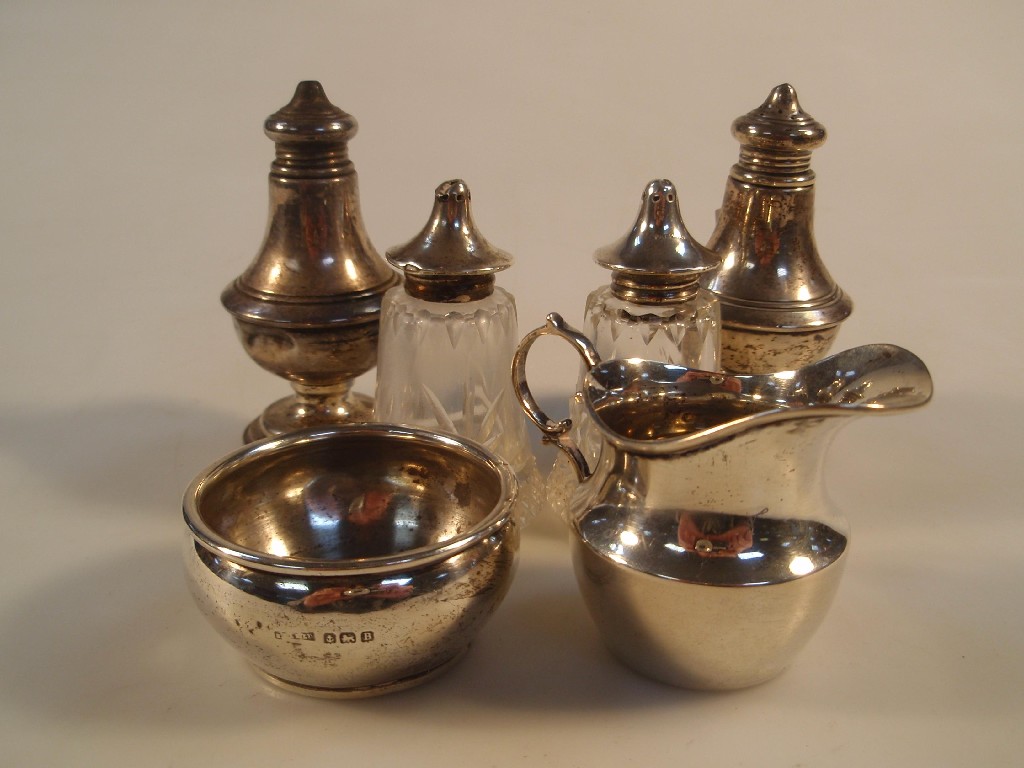 Appraisal: A matched miniature silver cream jug and sugar bowl and