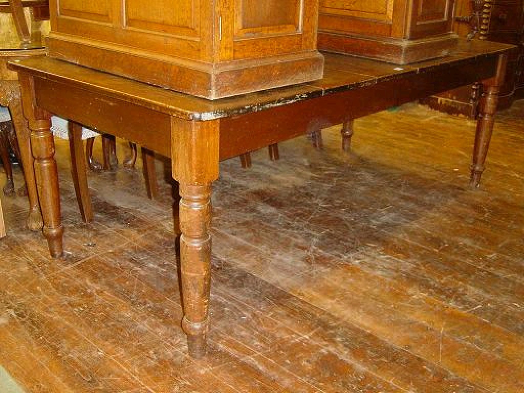 Appraisal: A Victorian teakwood dining table of rectangular form raised on