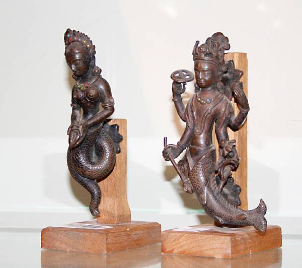 Appraisal: Two small Nepalese bronze deities One of female form emerging