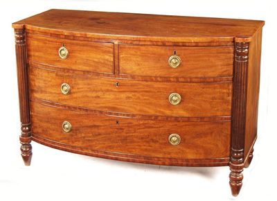 Appraisal: An early th century mahogany barrel front chest with two