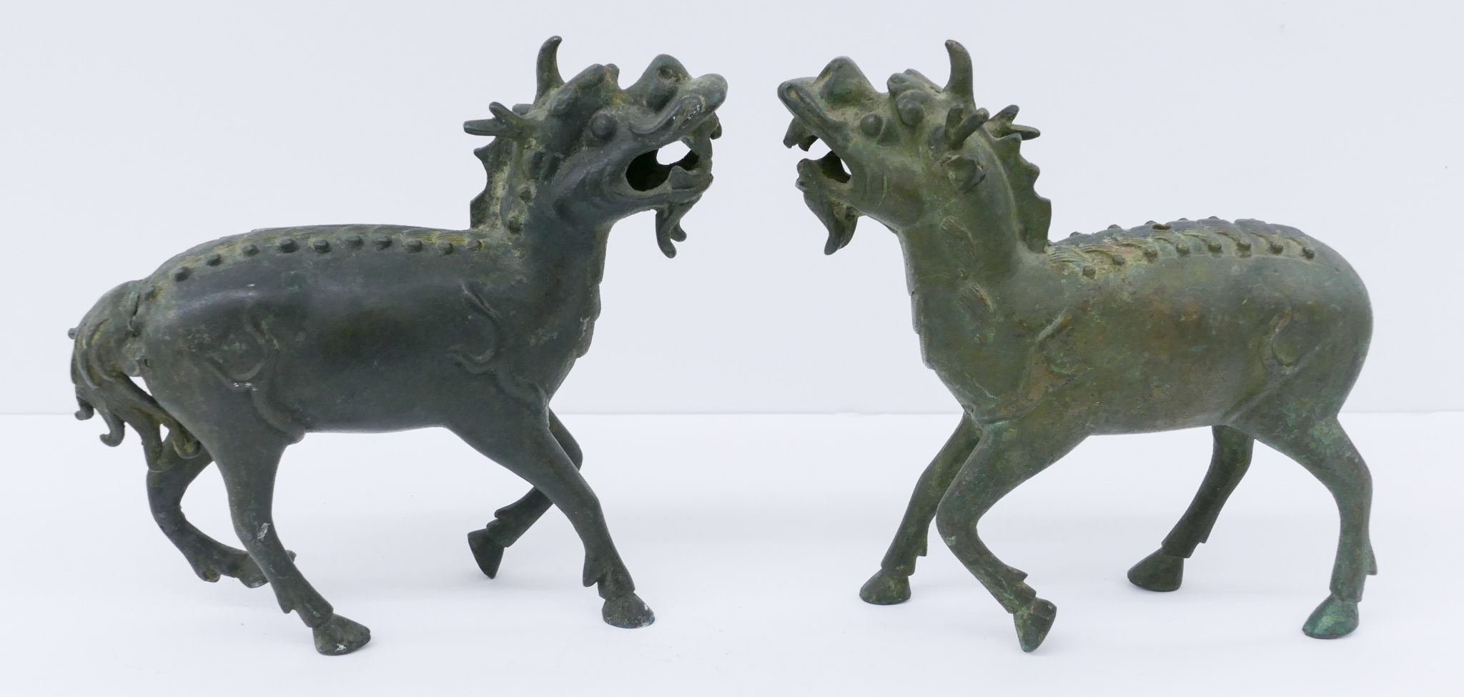 Appraisal: Pair Chinese Qing Bronze Qilin Figures ''x '' A duo