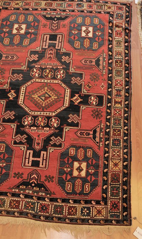 Appraisal: SHIRVAN old Red central field with five blue medallions the