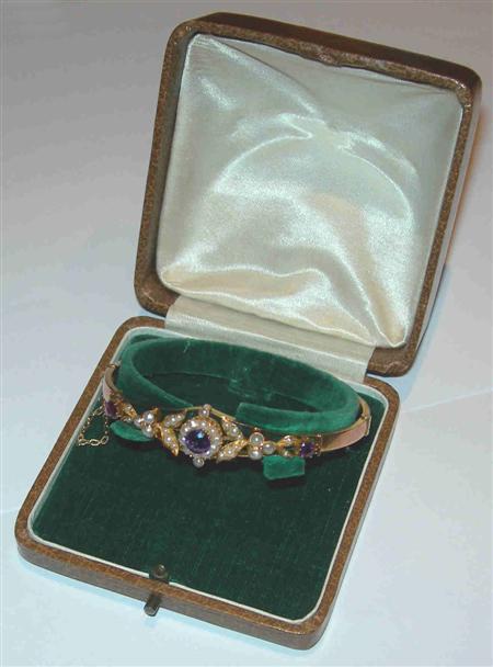 Appraisal: An Edwardian ct gold bangle of hinged design set to