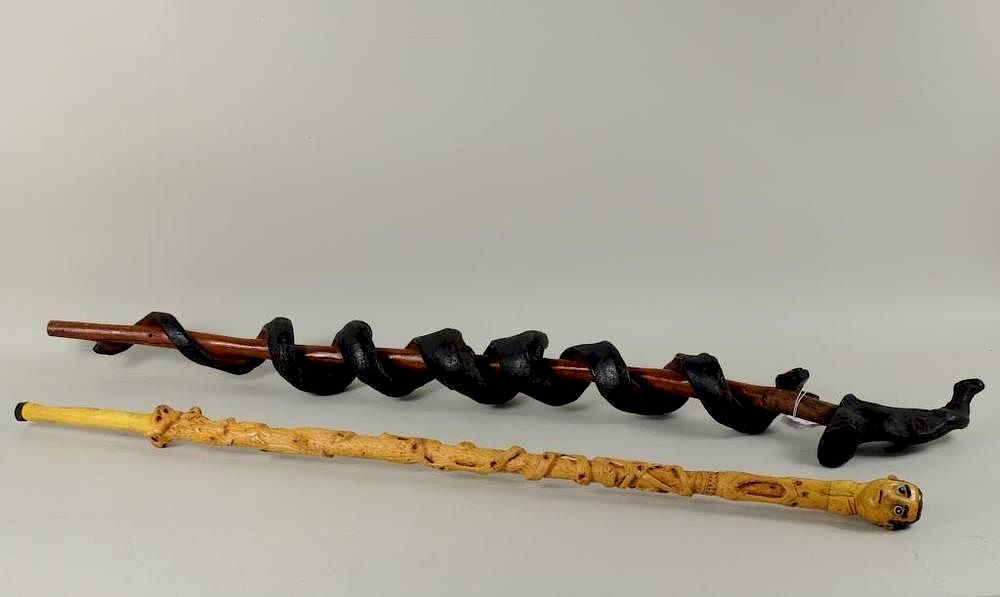 Appraisal: Two Folk Art Walking Sticks Two folk art walking sticks