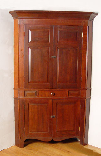 Appraisal: TH C CHERRY CORNER CUPBOARD Blind double doors top and