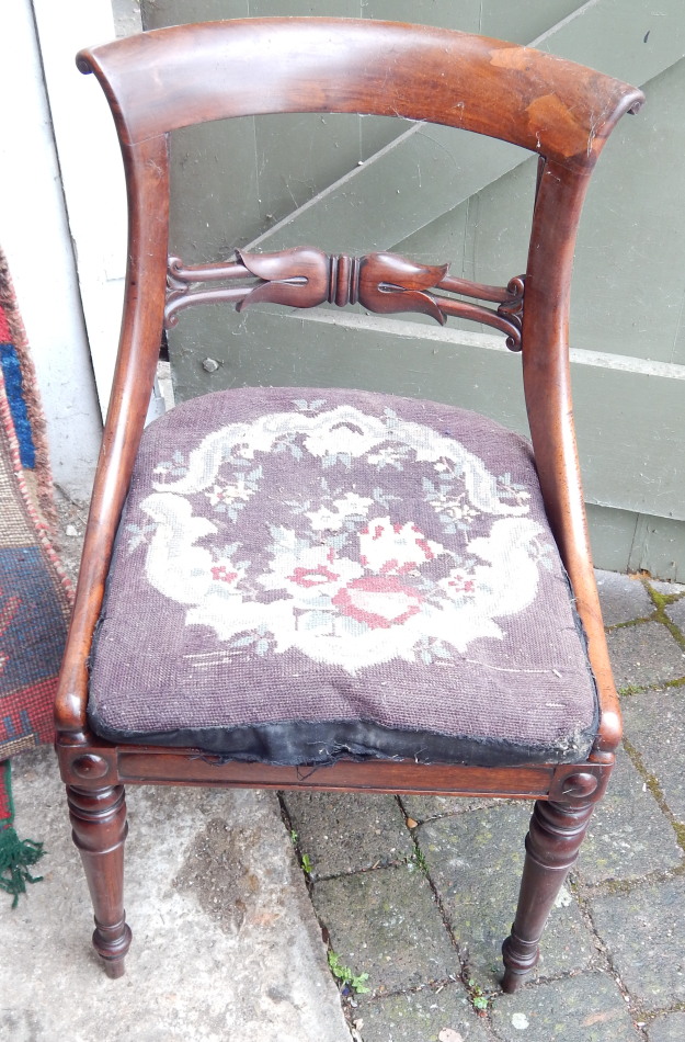 Appraisal: A William IV flamed mahogany chair with tulip bar back