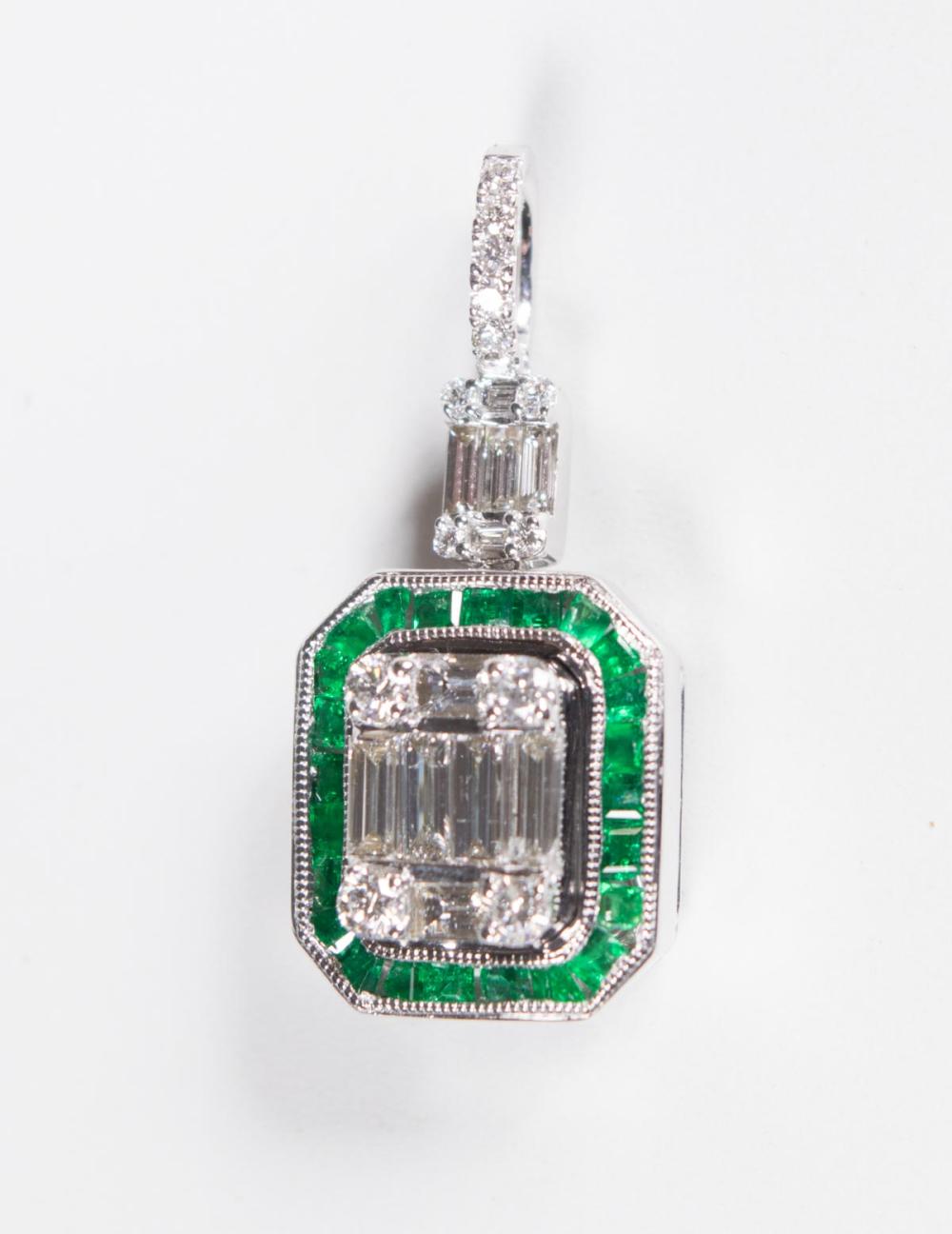 Appraisal: DIAMOND EMERALD AND EIGHTEEN KARAT GOLD PENDANT The k white