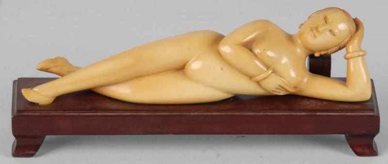 Appraisal: Ivory Reclining Doctor's Lady on Teak Wood Base Description Circa