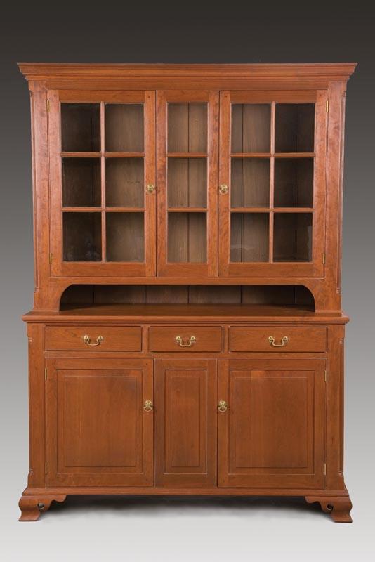 Appraisal: CHIPPENDALE-STYLE CUPBOARD American late th century cherry and poplar Two-piece