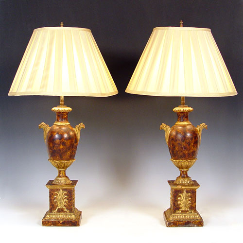 Appraisal: TH CENTURY CARVED GILT WOOD LAMPS Tortoise finish Base measures