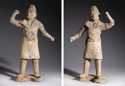 Appraisal: A pair of large Chinese black pottery figures of grooms