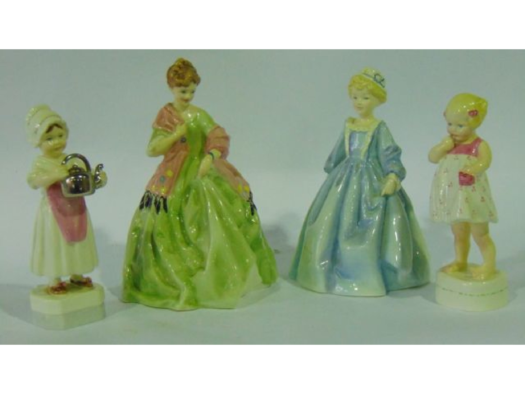 Appraisal: A collection of four Royal Worcester figures - First Dance