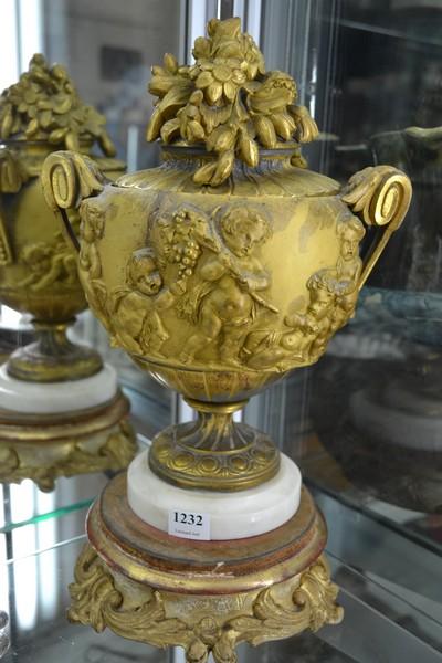 Appraisal: PAIR OF GILT AND BRONZE LIDDED URNS ON VELVET AND