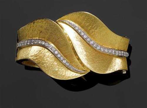 Appraisal: GOLD AND DIAMOND BRACELET Yellow gold g Attractive broad bracelet