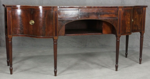 Appraisal: English Sheraton Mahogany SideboardHaving serpentine ends one bottle drawer with