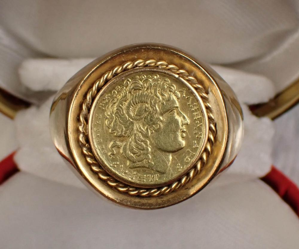 Appraisal: MAN'S GOLD COIN SOLITAIRE RING featuring a replica Greek Stater