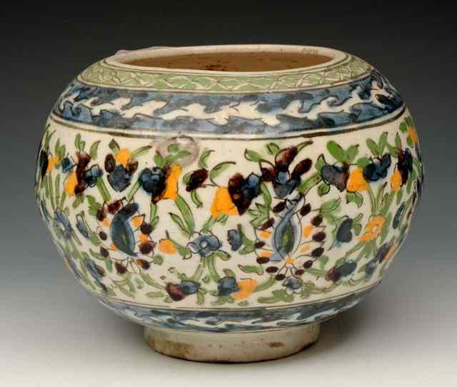 Appraisal: A PERSIAN OVOID BOWL decorated in the Iznik style across