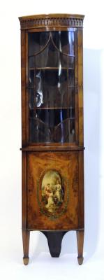 Appraisal: AN EDWARDIAN SATINWOOD STANDING CORNER CUPBOARD of bowed form crossbanded