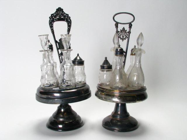 Appraisal: Two ornate Victorian -bottle caster sets each is complete bottles