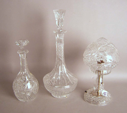 Appraisal: Two cut glass decanters h h together with a table