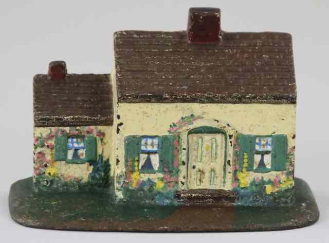 Appraisal: COTTAGE DOORSTOP Cast iron one story done in white and