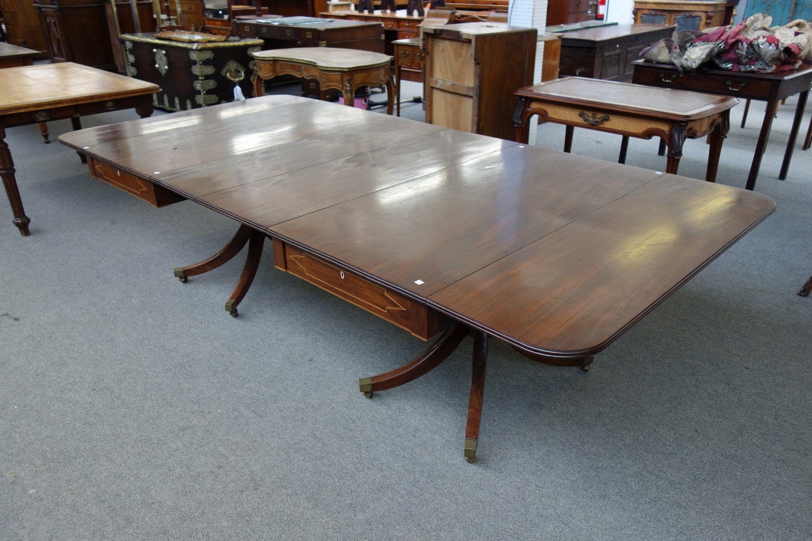 Appraisal: A George III mahogany twin pedestal drop flap dining table