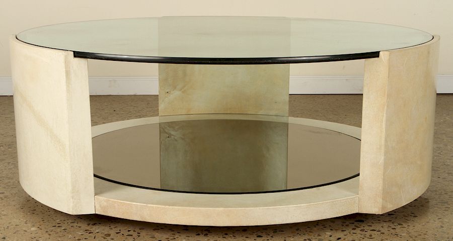 Appraisal: PARCHMENT KARL SPRINGER STYLE COFFEE TABLE A substantial glass top