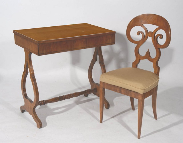 Appraisal: A BIEDERMEIER WALNUT WRITING TABLE with rectangular top and lyre