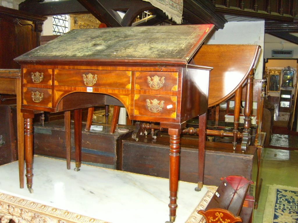 Appraisal: An Edwardian mahogany architects table with inset leather top fitted