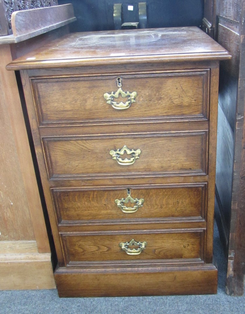 Appraisal: A th century oak two drawer filing cabinet fronted as