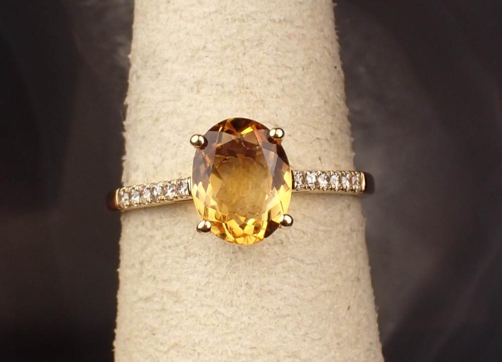 Appraisal: CITRINE DIAMOND AND FOURTEEN KARAT GOLD RING The yellow gold