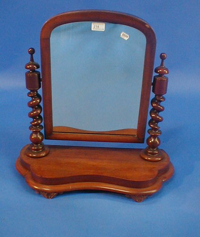 Appraisal: A Victorian mahogany dressing table mirror with barley twist supports