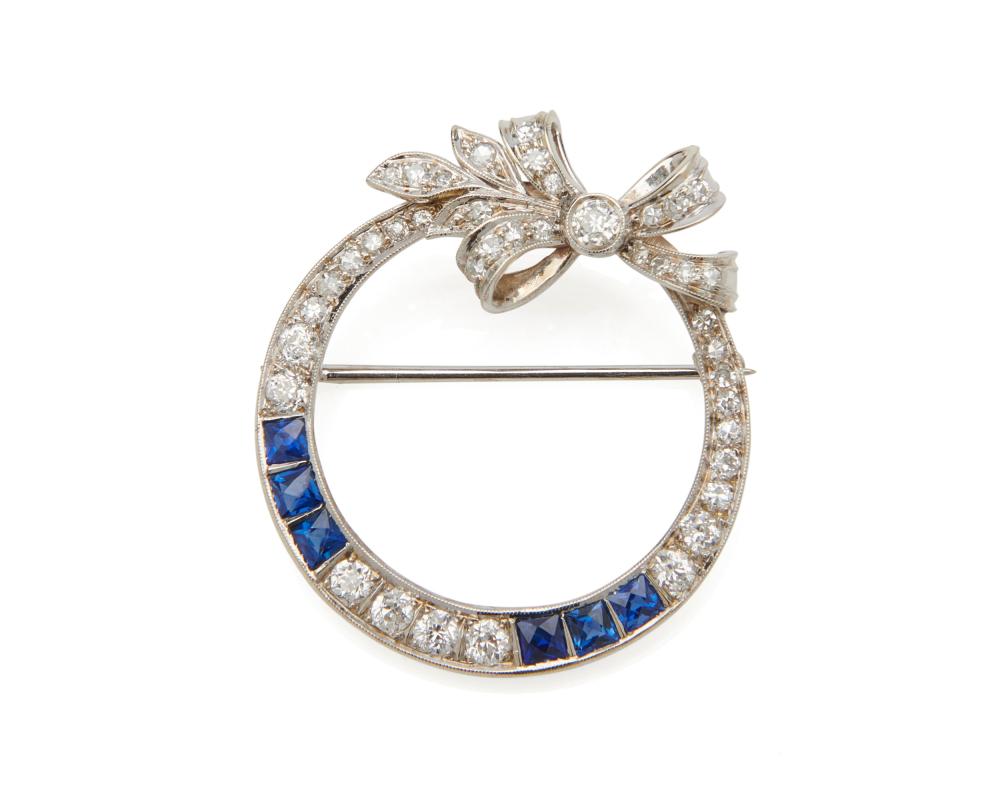 Appraisal: K Gold Diamond and Sapphire Brooch the circle-form brooch featuring