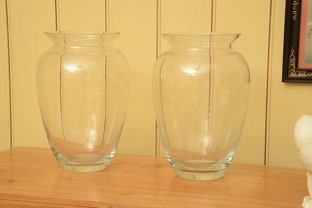 Appraisal: A PAIR OF GLASS BALUSTER VASES with flaring rims high