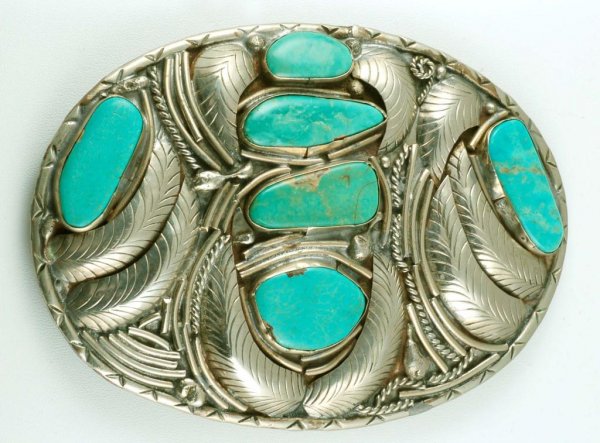 Appraisal: A large oval sterling silver belt buckle set with cut