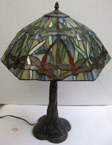 Appraisal: A STAINED AND LEADED GLASS DRAGON-FLY TABLE LAMP The tree