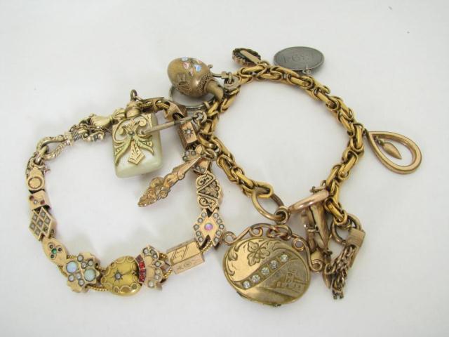 Appraisal: Two Victorian gold-filled charm and slide bracelets with various stones