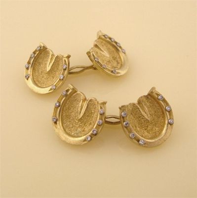 Appraisal: A pair of gold horse-shoe cuff links set with seven