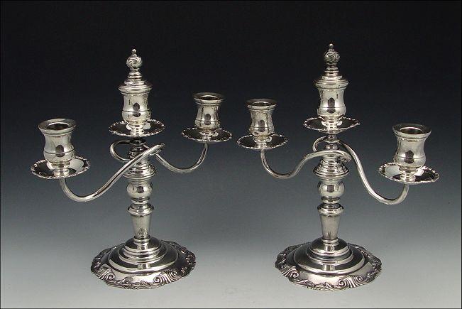 Appraisal: PAIR LIGHT STERLING CANDLE HOLDERS Weighted sterling base Simply marked