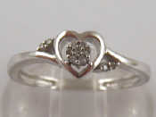 Appraisal: A carat white gold ring with diamond set heart motif