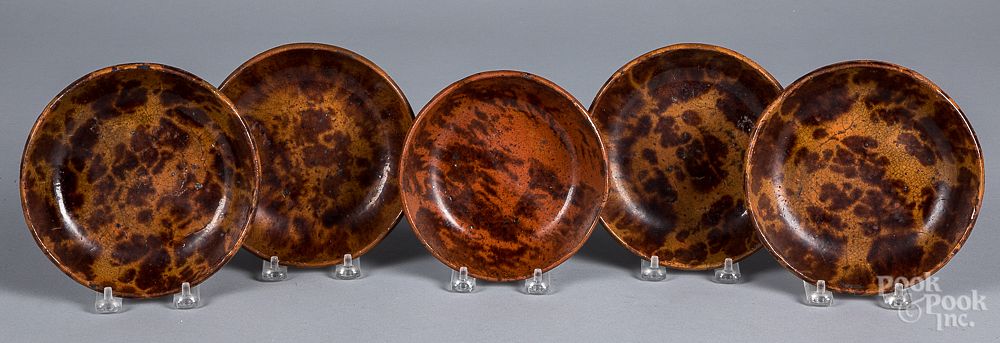 Appraisal: Five redware shallow bowls th c Five redware shallow bowls