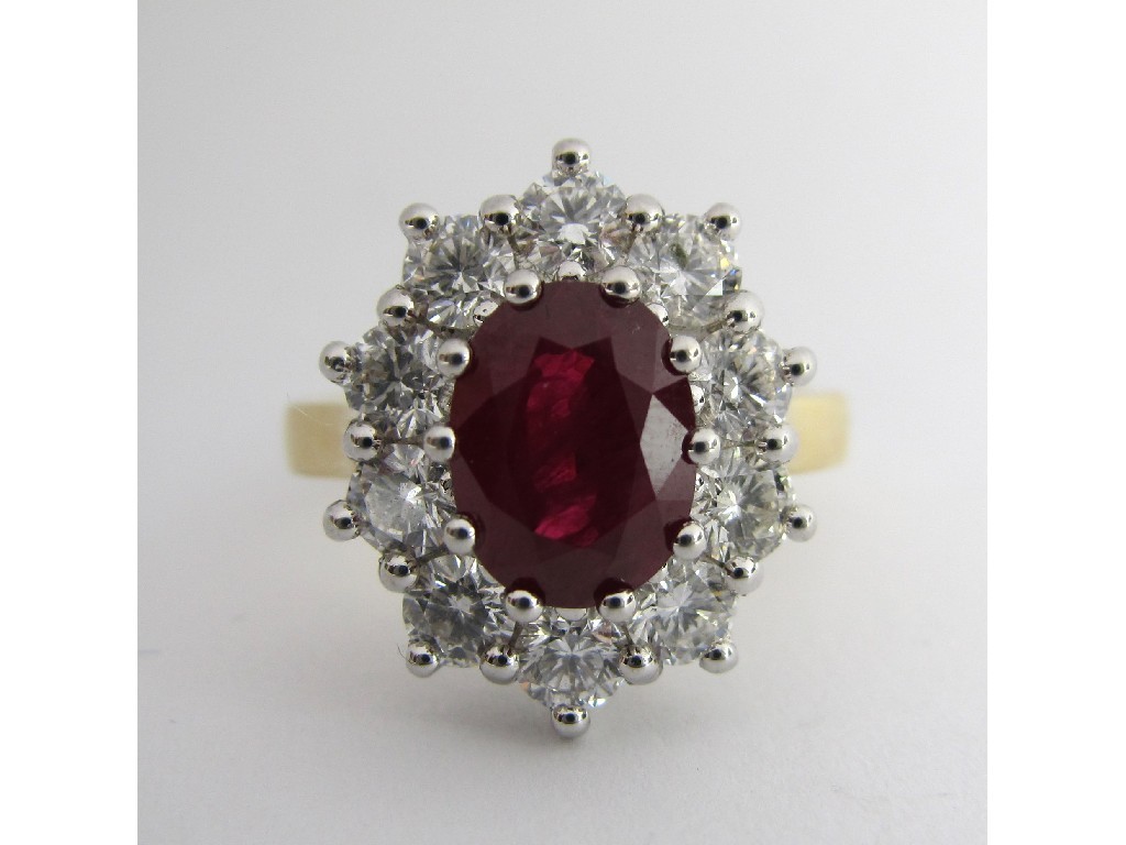 Appraisal: Eighteen carat gold ruby and diamond cluster ring with central